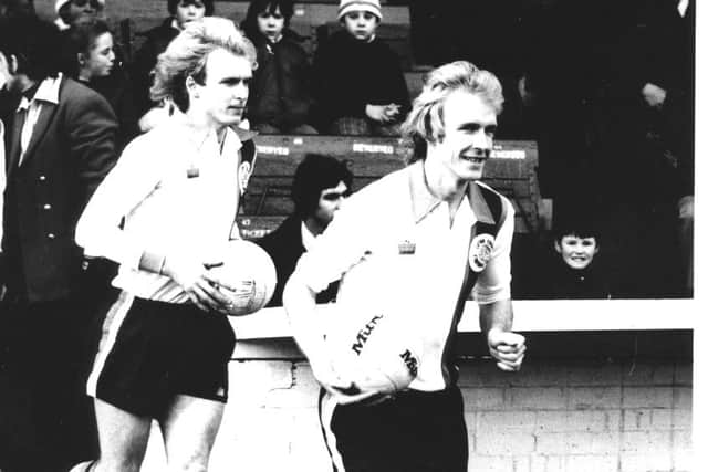 Paul and Ron Futcher run out for the Hatters