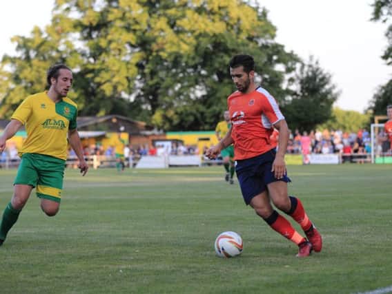 Town's trialist midfielder in action at Hitchin this evening