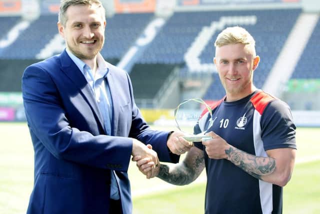 Craig Sibbald is presented with the Falkirk Herald Starshot Award for last season by sports editor David Oliver - pic: Michael Gillen