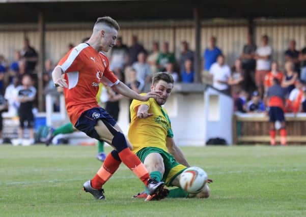 Connor Tomlinson scores at Hitchin on Wednesday evening
