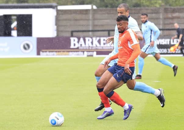 Isaac Vassell holds the ball up against Boreham Wood