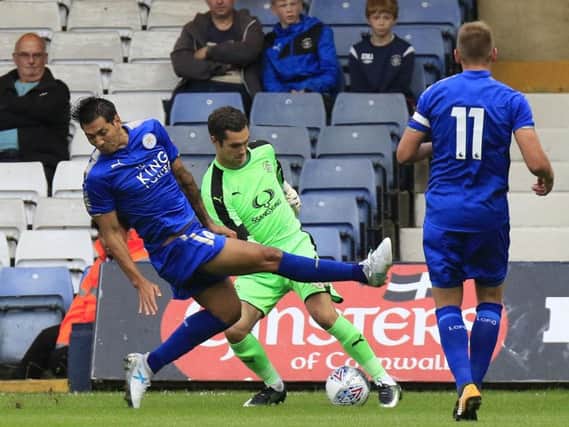 Town keeper James Shea dribbles round Leicester striker Leonardo Ulloa