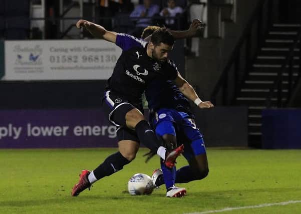 Elliot Lee is challenged during Town's pre-season clash with Leicester