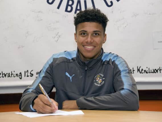 James Justin signs his deal with Luton