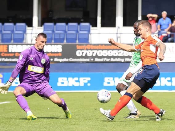 James Collins nets his first goal of the afternoon for Luton