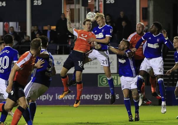 Glen Rea goes up for a header against Ipswich