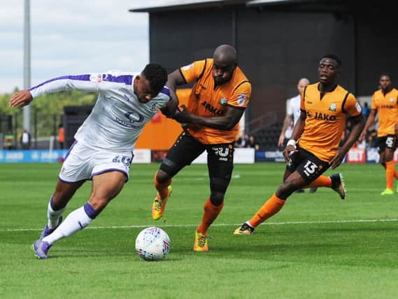 Isaac Vassell tries to burst clear against Barnet