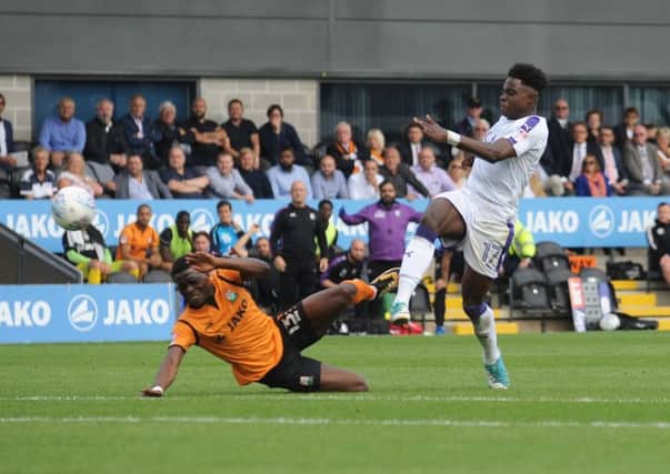 Pell-Ruddock Mpanzu shoots for goal against Barnet