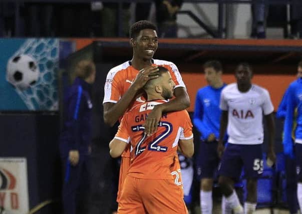 Luke Gambin celebrates winning the penalty shootout with youngster Tyreeq Bakinson