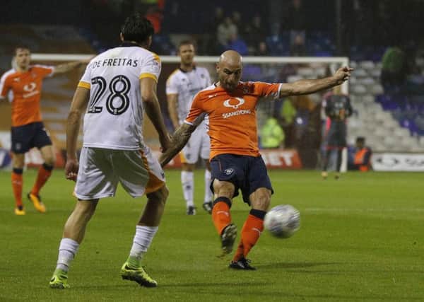 Hatters midfielder Alan McCormack sends the ball wide against Port Vale
