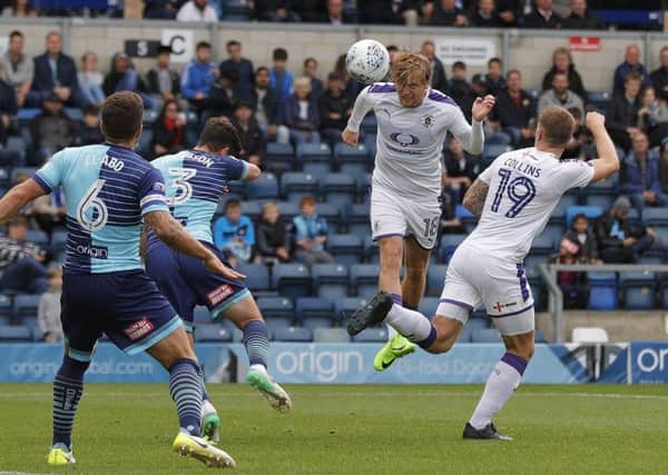 Luke Berry gets up to head at goal against Wycombe