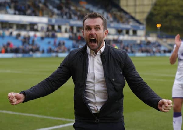 Hatters boss Nathan Jones celebrates Town's 2-1 victory at Wycombe