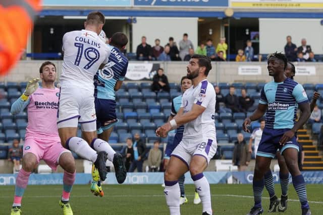 James Collins heads home Town's winner at Wycombe