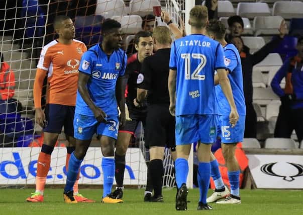 Hatters keeper James Shea is shown the red card against Barnet - but it was quickly changed to a yellow