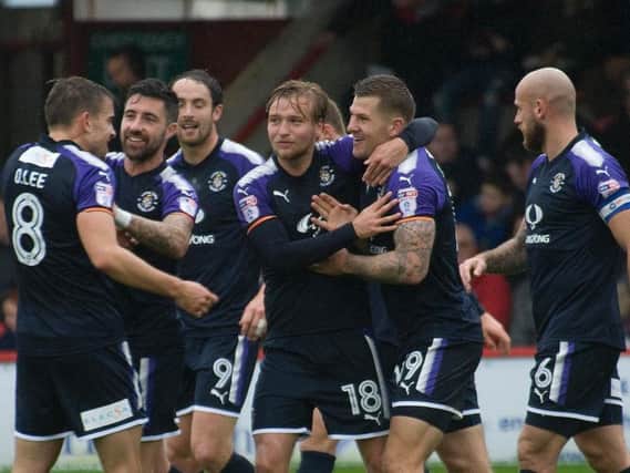 Hatters celebrate James Collins' opener at Accrington this afternoon
