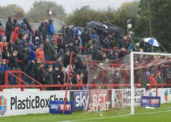 Luton's supporters get a soaking at Accrington