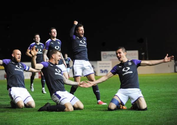 Dan Potts celebrates putting Luton 2-1 in front at Exeter on Tuesday night