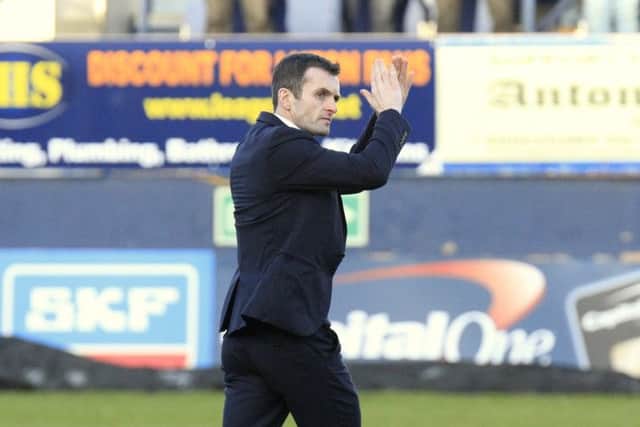 Hatters boss Nathan Jones applauds the fans ahead of his first game against Cambridge