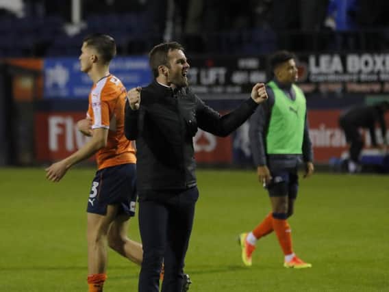 Hatters boss Nathan Jones celebrates the 1-0 win over Portsmouth