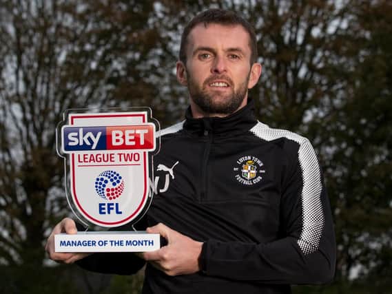 Hatters boss Nathan Jones with his manager of the month trophy