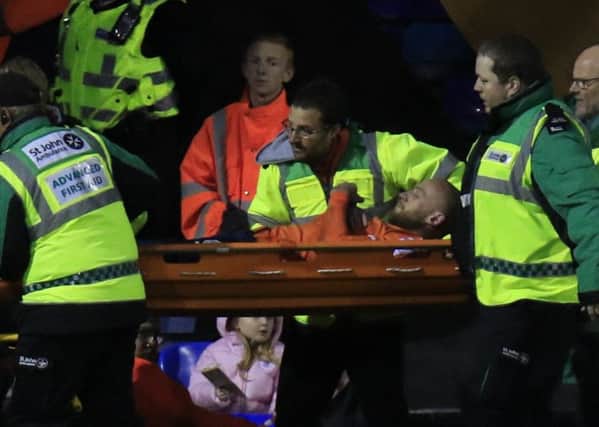 Hatters skipper Scott Cuthbert is stretchered off against Cambridge on Saturday
